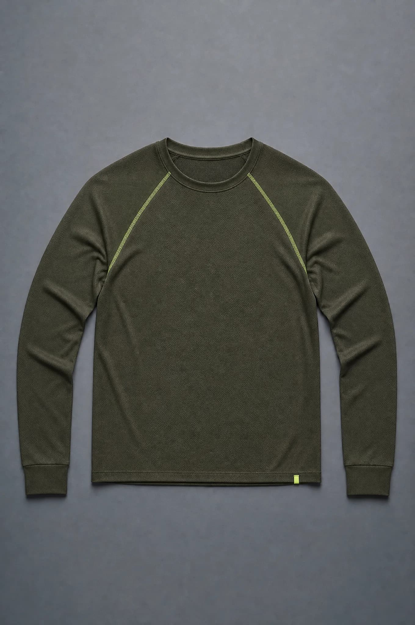 A dark olive raglan long-sleeve top photographed flat from above, empty and unworn, showing the diagonal raglan seam and a ribbed hem.